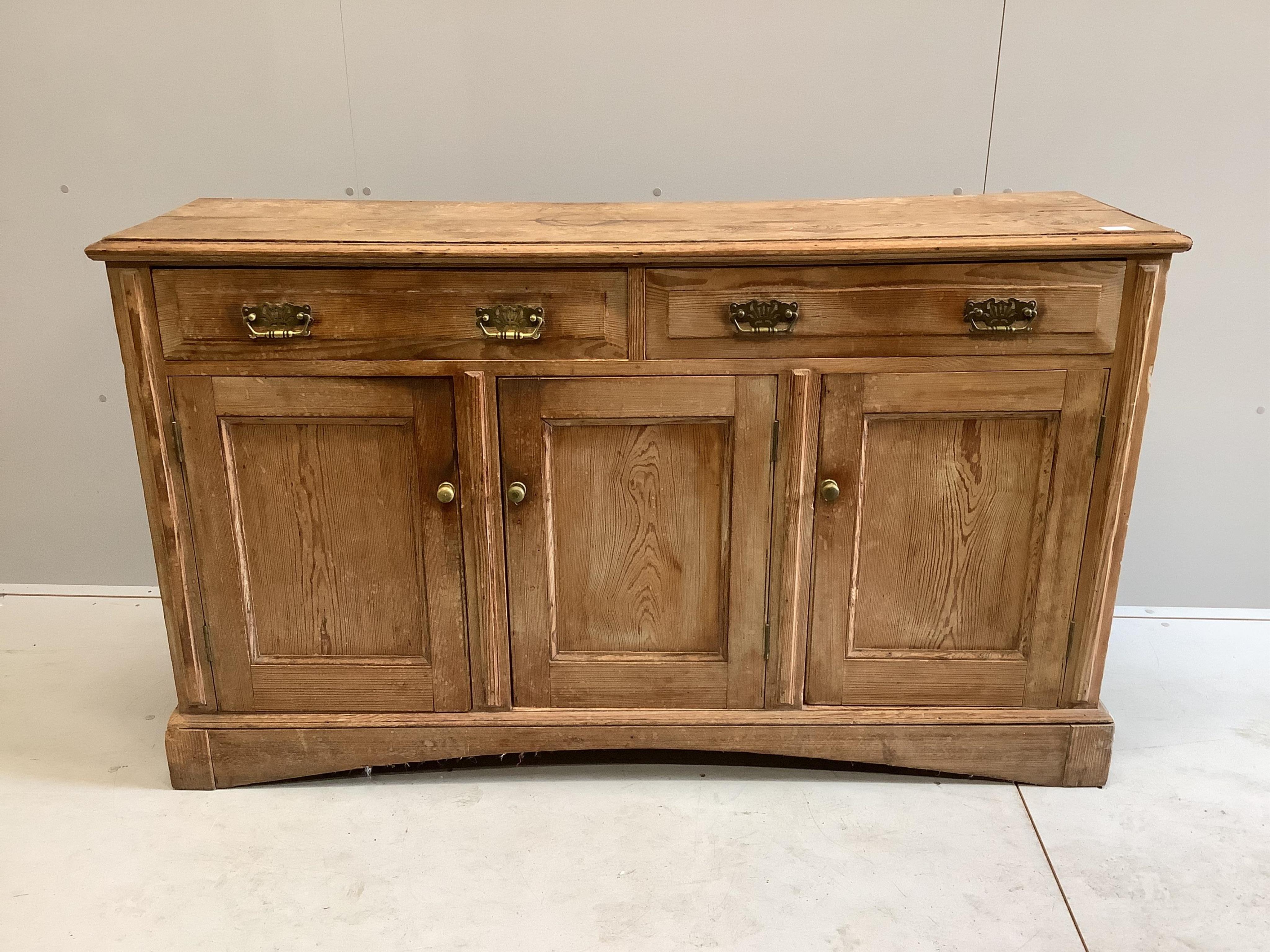 A late Victorian pitch pine low dresser, width 155cm, depth 43cm, height 92cm. Condition - poor